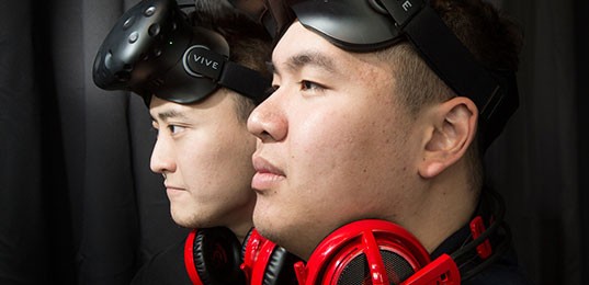 Image of 2 men wearing VR headsets on the foreheads